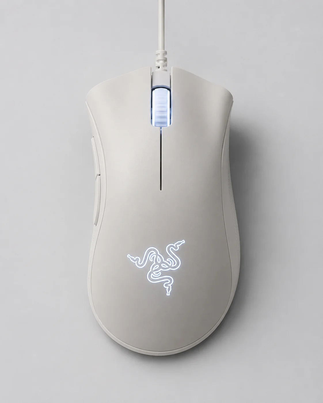 My white Razer DeathAdder Essential mouse viewed from the top with logo lighting