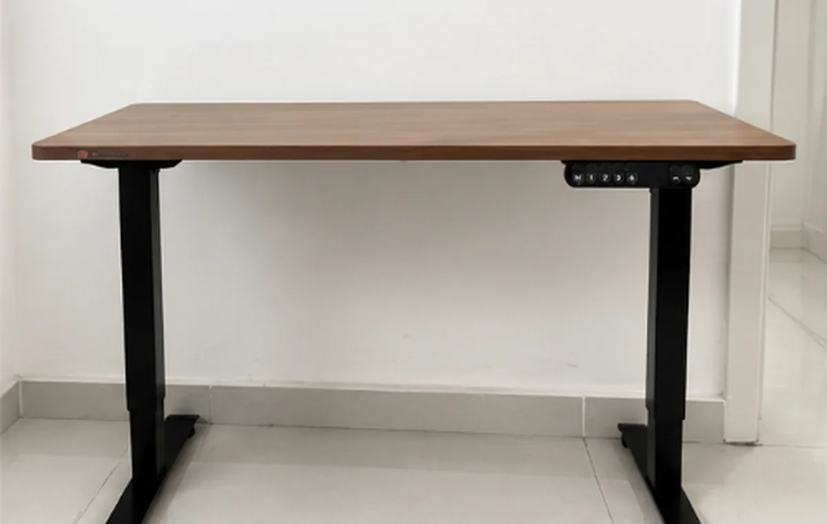 My SIHOO standing desk with a walnut desktop and black metal frame after about two years of use