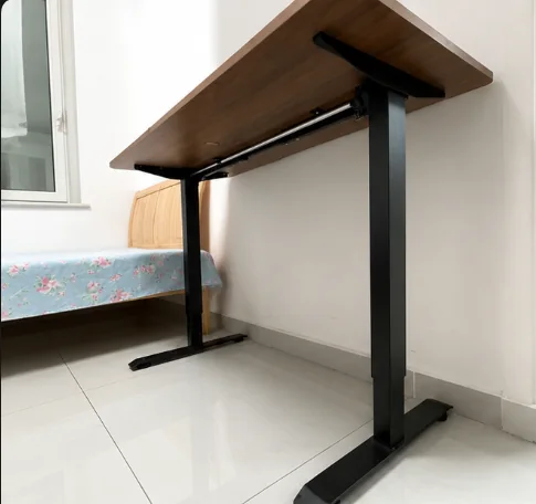 Underside view of my SIHOO standing desk showing the black frame and cable area
