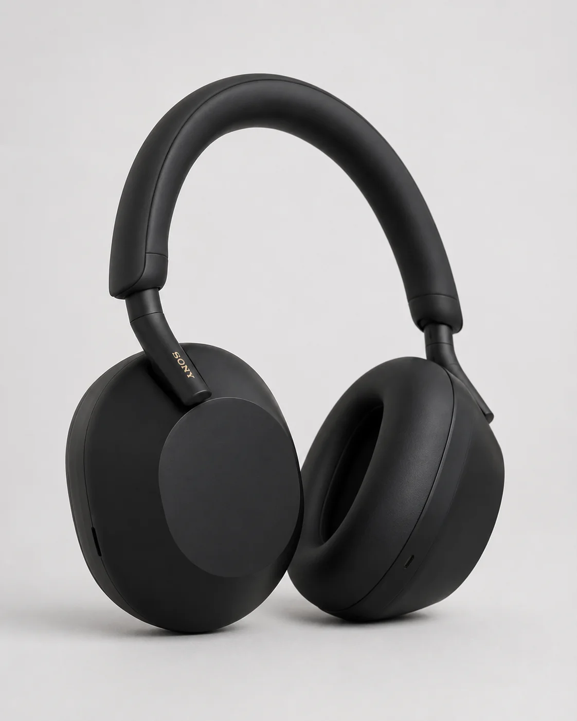 My black Sony WH-1000XM5 headphones photographed upright on a light background