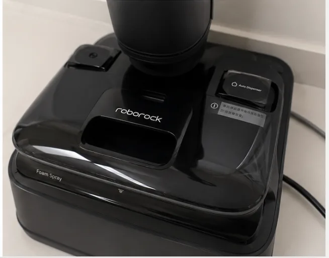 Dock base of my Roborock A30 Pro showing foam spray and auto dispenser labels
