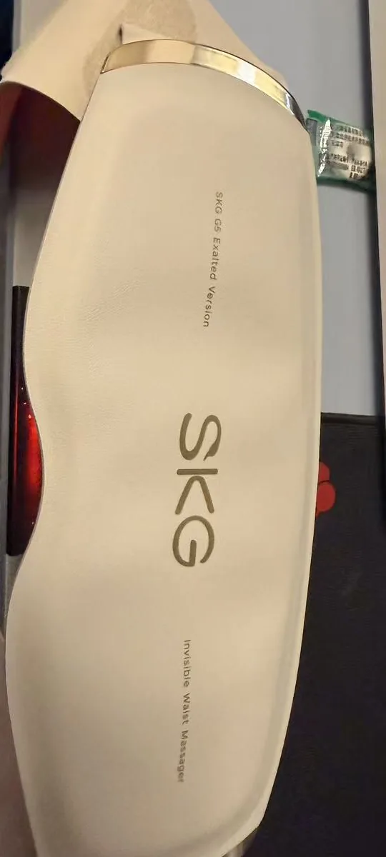 Outer side of the SKG G5 Invisible Waist Massager showing the SKG logo and Exalted Version text